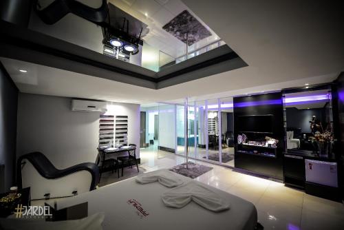 En eller flere senge i et værelse på Motel Premium (Adults Only)