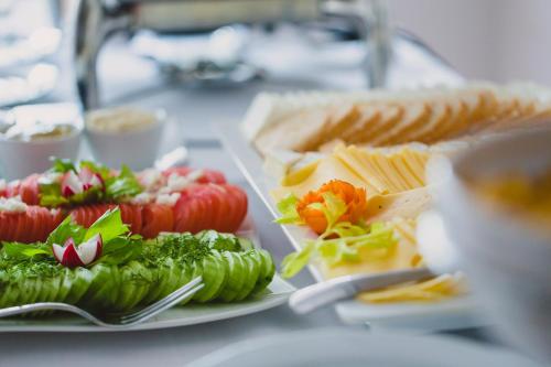a plate of food with vegetables and crackers on a table at Atol Spa in Świnoujście