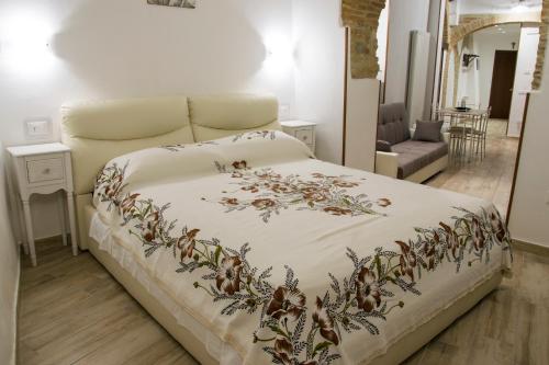 Postel nebo postele na pokoji v ubytování Le Vecchie Mura Apartment