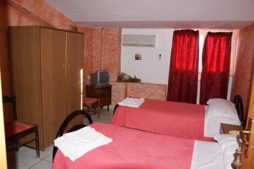 Een bed of bedden in een kamer bij La Conca D'oro