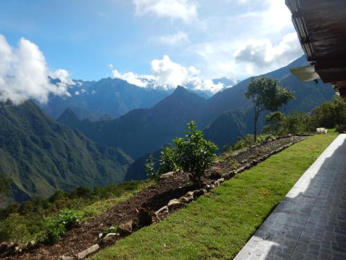 a mountain road with a view of mountains at Llactapata Lodge overlooking Machu Picchu - camping - restaurant in Salcantay