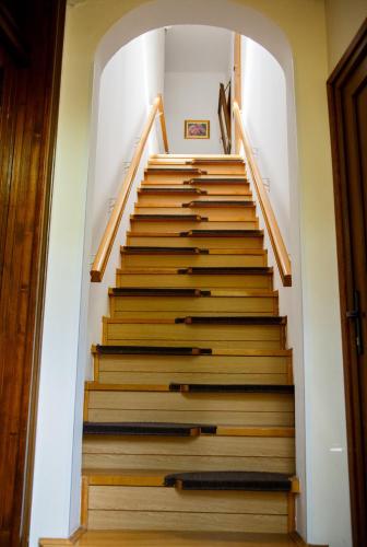 a staircase in a house with wooden steps at Apartment Ferk in Zagreb