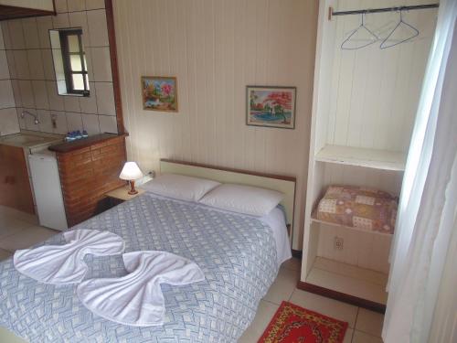 Postel nebo postele na pokoji v ubytování Chales Marigu