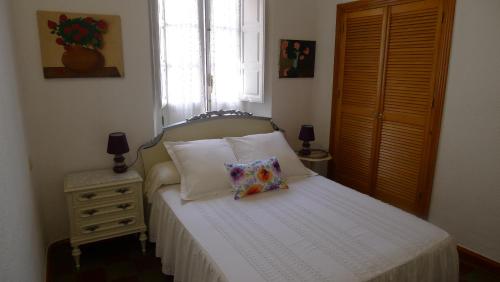 Uma cama ou camas num quarto em Casa Andaluza