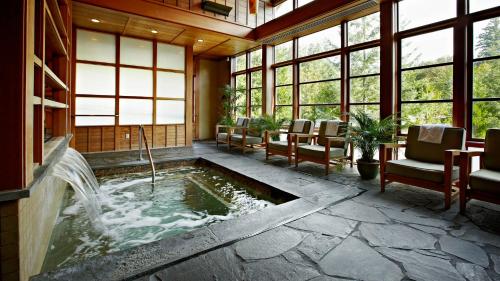 a room with a water fountain in the middle of a building at Salish Lodge & Spa in Snoqualmie