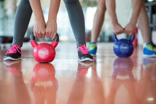 a group of people doing exercises with a red pig on the floor at Hotel Gran Palma Huancayo in Huancayo