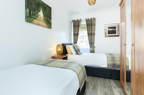 Ein Bett oder Betten in einem Zimmer der Unterkunft Luxury City Centre Apartment