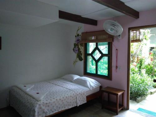 Ένα ή περισσότερα κρεβάτια σε δωμάτιο στο Hostal Capurgana
