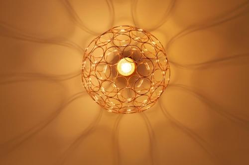 a close up of a light bulb on a ceiling at Hotel West in Hamburg