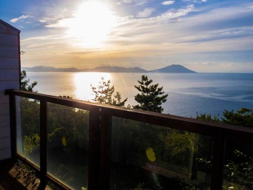 a view of the ocean from the balcony of a house at Irou in Tonosho