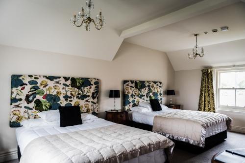 Llit o llits en una habitació de The Grange B&B