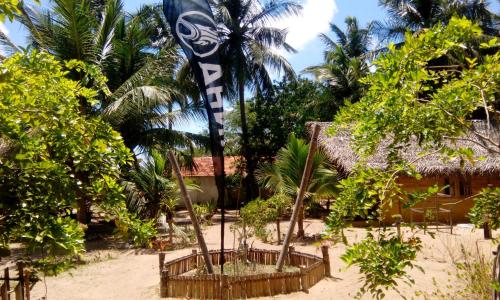 a flag on the beach in front of a resort at Margarita Village kite school kalpitiya in Kalpitiya