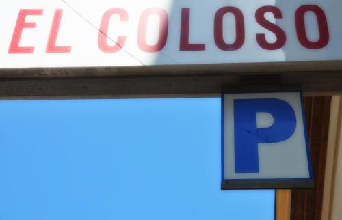 a sign for a gas station with a p sign at Hotel El Coloso in Jerez de la Frontera