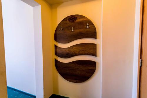 a wall with a circular painting on a wall at Hotel Rostov in Pleven