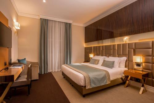 Hotel Gioberti tesisinde bir odada yatak veya yataklar