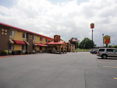a large parking lot in front of a hotel at Super 8 South by Wyndham in Bowling Green