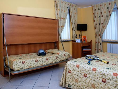 Postel nebo postele na pokoji v ubytování Hotel Agata