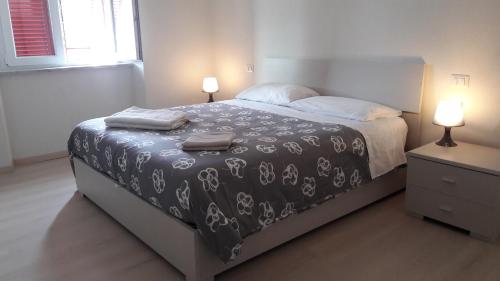 Ένα ή περισσότερα κρεβάτια σε δωμάτιο στο Residenza Lux fronte mare