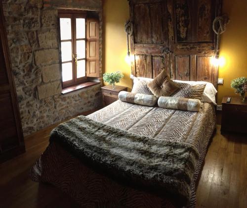 Postel nebo postele na pokoji v ubytování La Casona de Rudagüera
