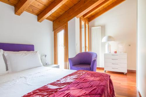 Parco di Monza Apartment tesisinde bir odada yatak veya yataklar