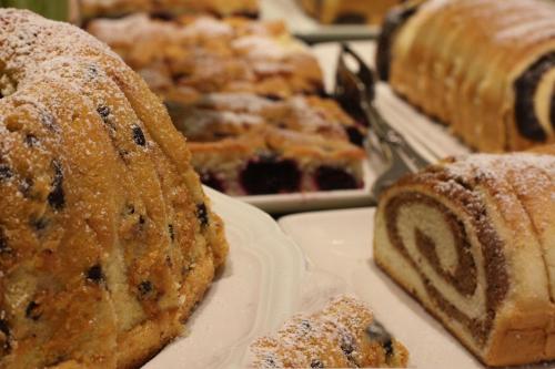 a bunch of different types of bread on plates at Hotel Goldener Ochs in Bad Ischl