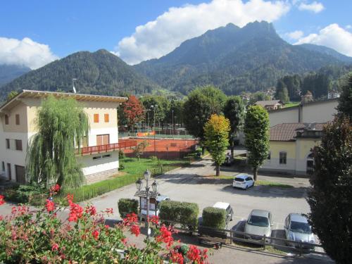a view of a parking lot with mountains in the background at Casa Caterina in Fiera di Primiero