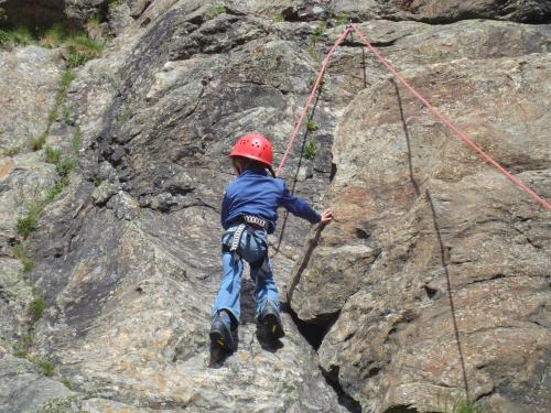 a young boy on a rock climbing rope at Ferienwohnung Moritz in Kaunertal