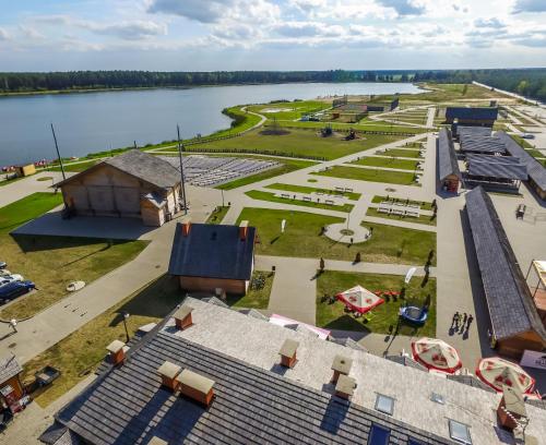 an aerial view of a park next to a body of water at Kurpiowska Kraina in Wydmusy