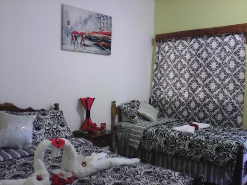 Кровать или кровати в номере Hotel California