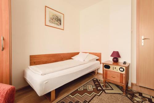 Cama o camas de una habitación en Pokoje Gościnne Akropol