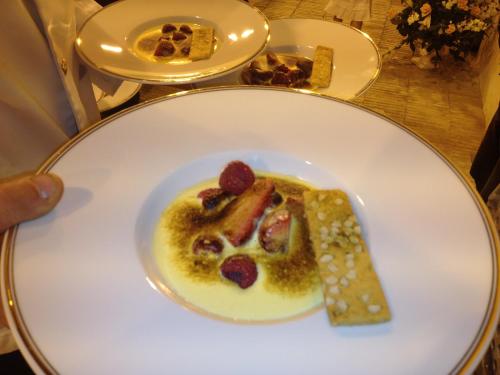 a white plate with a dessert on a table at Château de Saint Loup in Saint Loup Lamaire