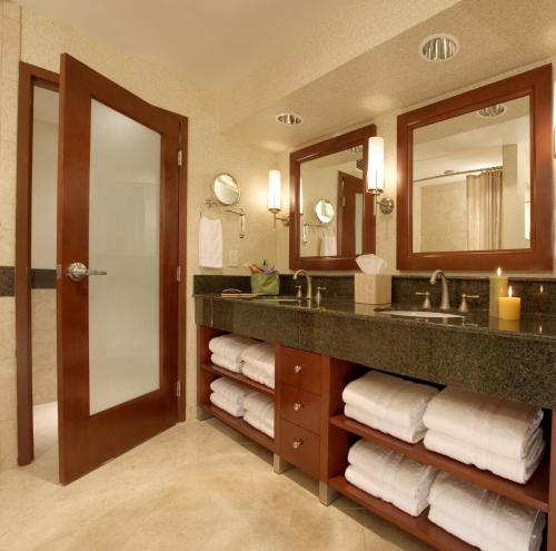 a bathroom with a sink and a mirror at Monterey Bay Inn in Monterey