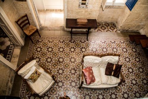 an overhead view of a bedroom with a bed and pillows at Valletta Period Townhouse in Valletta