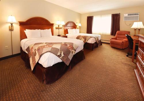 Кровать или кровати в номере Centerstone Plaza Hotel Soldiers Field - Mayo Clinic Area