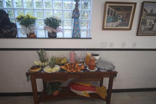 a table with a bunch of food on it at Hotel Terra Mater in Porto Seguro