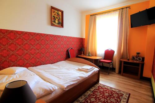 Postel nebo postele na pokoji v ubytování FusGym Resort