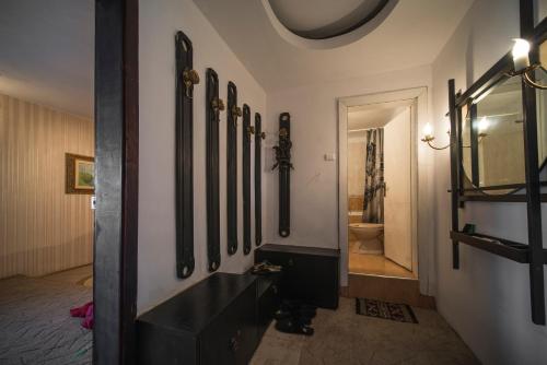 a hallway with a row of mirrors on a wall at Sunny Apartment Sofia in Sofia