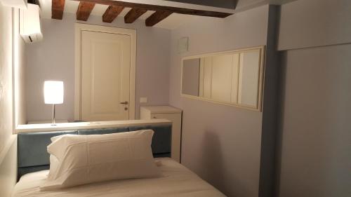 Ένα ή περισσότερα κρεβάτια σε δωμάτιο στο Maison d'Elite Guest House