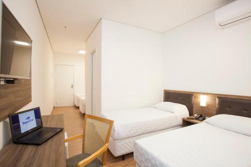 Кровать или кровати в номере Travel Inn Bras