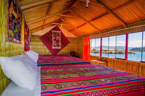 Кровать или кровати в номере Uros Qhota Uta Lodge