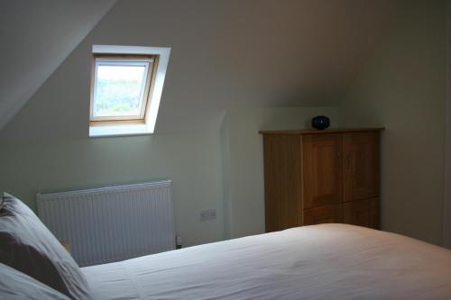 Ένα ή περισσότερα κρεβάτια σε δωμάτιο στο Highlands Apartment 4