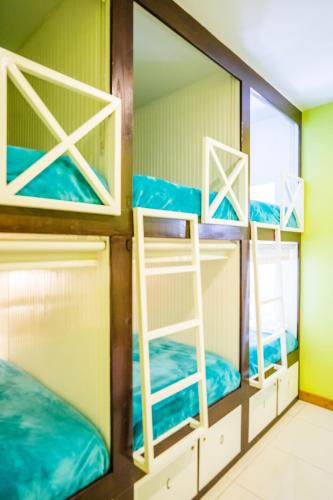a group of bunk beds in a room at Bed & Bike Curacao in Willemstad