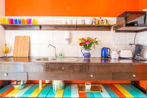 a kitchen with a counter with a sink at Bed & Bike Curacao in Willemstad