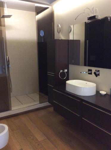 a bathroom with a sink and a shower at Suite con terrazza in centro storico in Catania