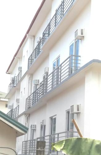 a white building with balconies on it at Mirage Suites de Boracay in Boracay