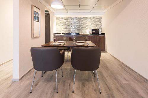 a dining room with a table and chairs at Barracuda Resort in Umm Al Quwain