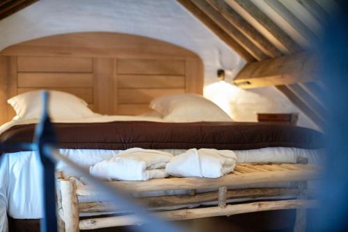 a bedroom with two beds with white pillows at Hotel Colvenier in Antwerp