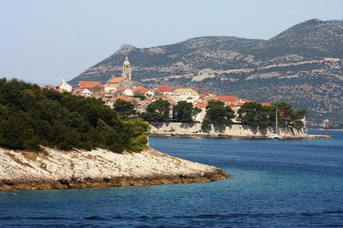 a town on the shore of a body of water at Luxury apartment Gabriela in Korčula