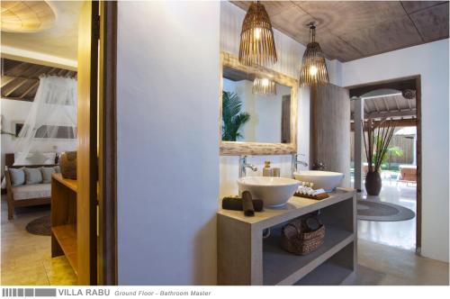 a bathroom with two sinks in a room at 3BR Villa Rabu - Minggu Villas Seminyak in Seminyak