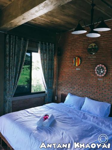 Postel nebo postele na pokoji v ubytování Antani Home @Khaoyai